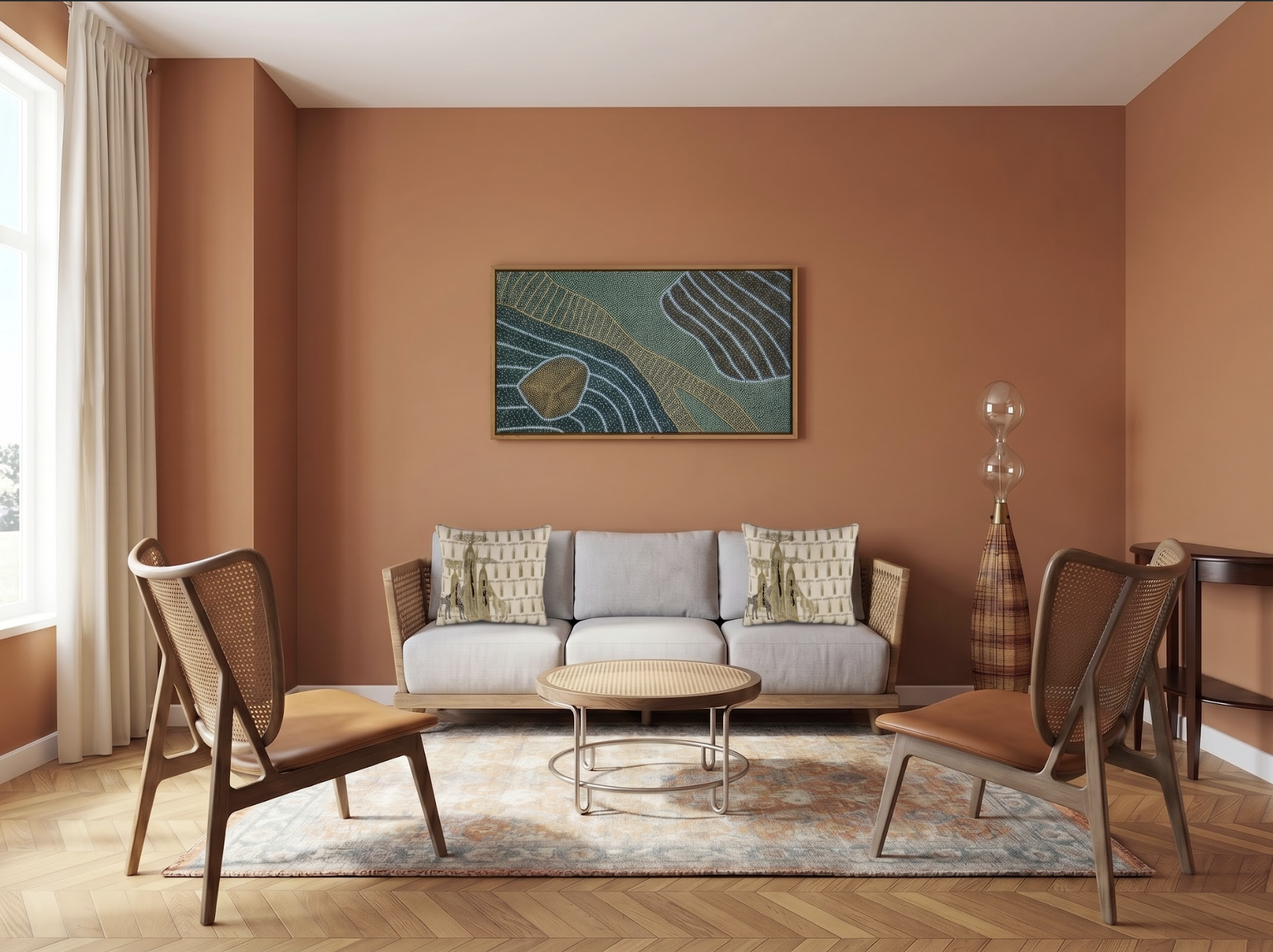 A small living room with a single, correctly sized patterned rug anchoring the sofa and two cane chairs